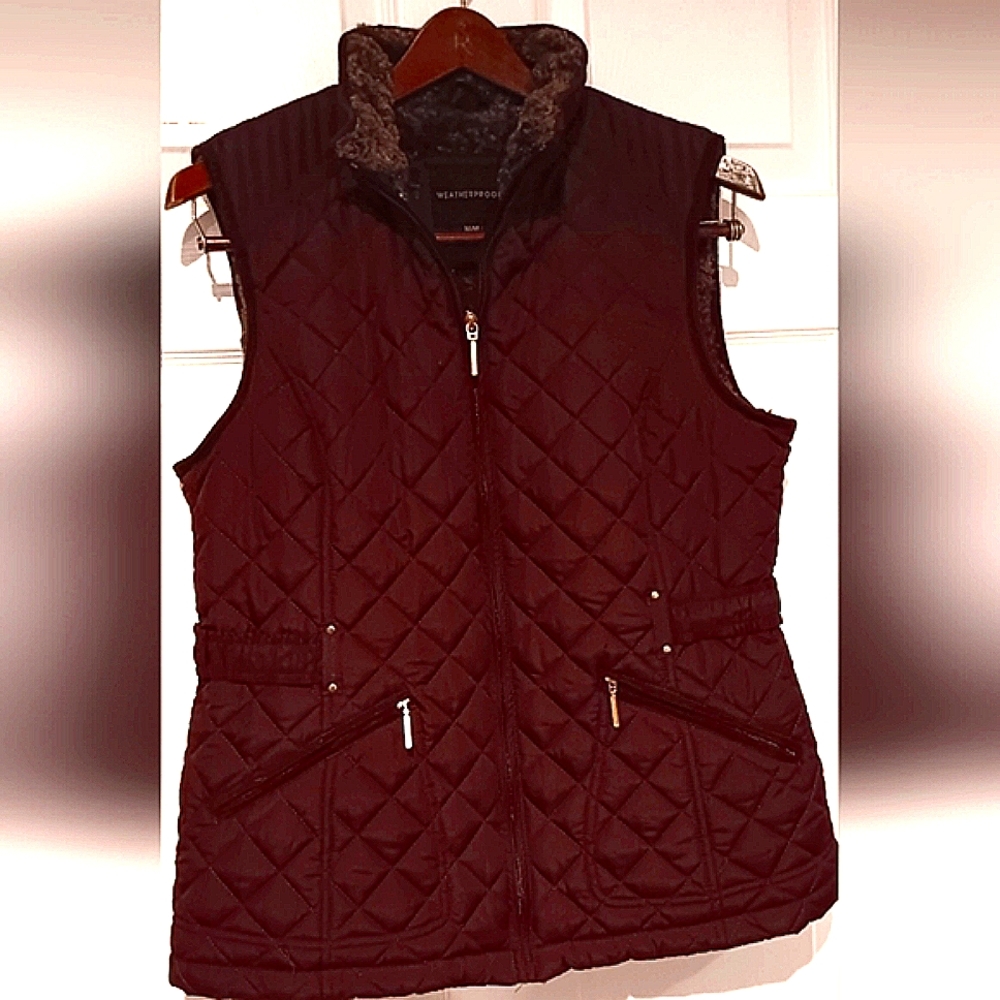 Weatherproof woman's M vest with faux shearling inside.